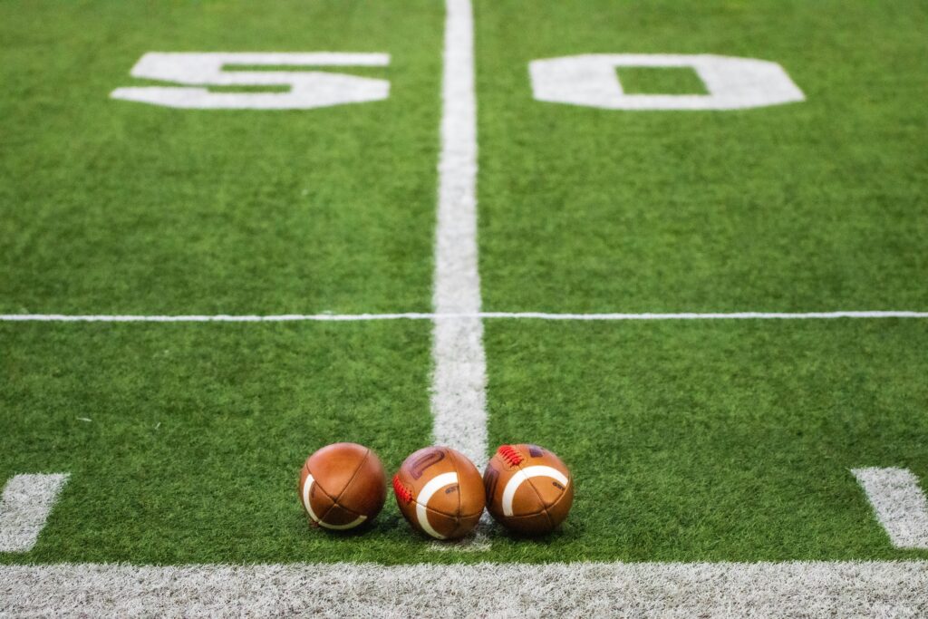 American Footballs on a field 